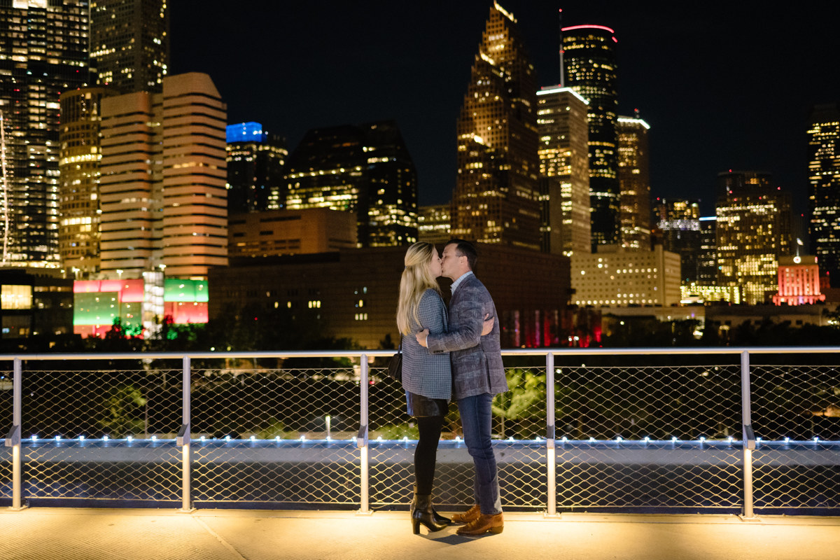 Post houston HTX garden rooftop proposal session during christmas with night houston skyline background