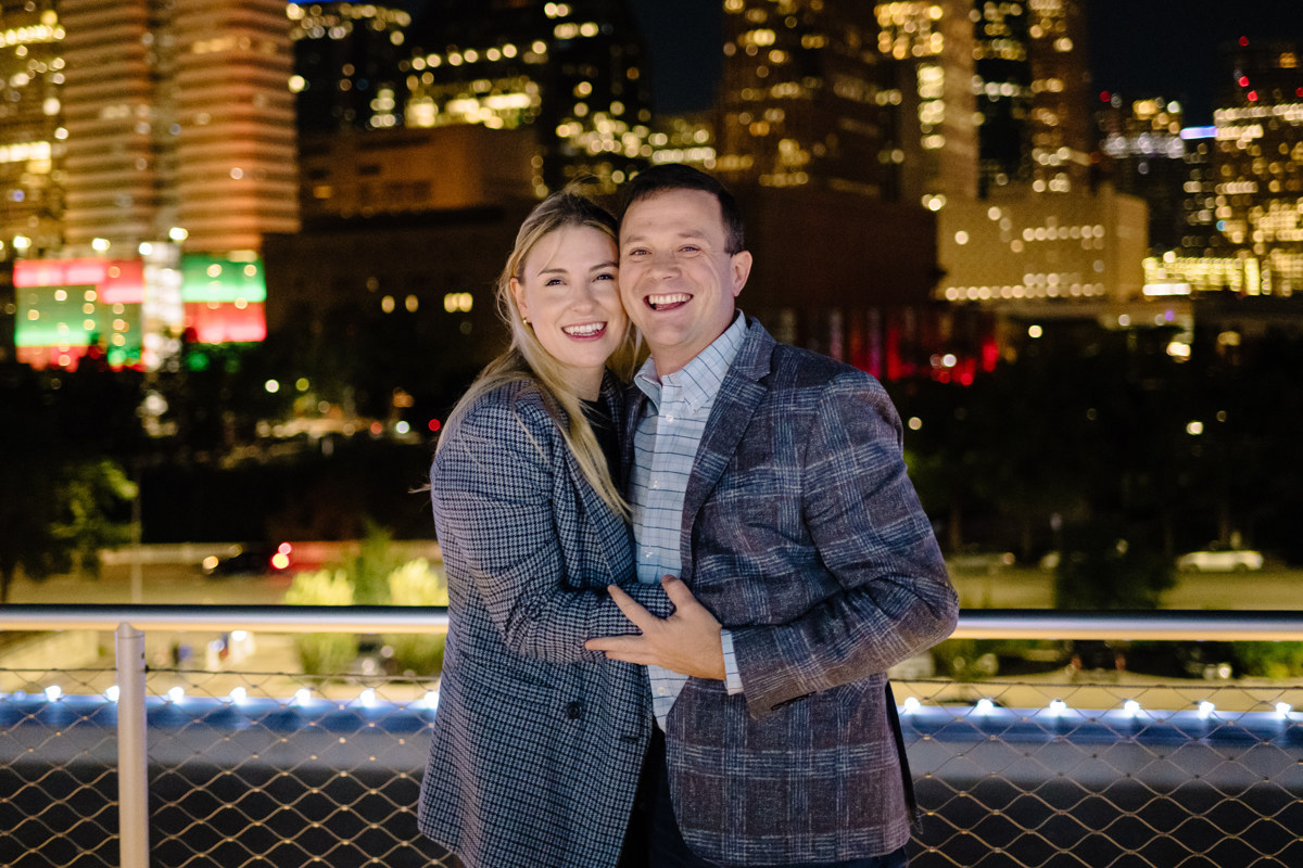 Post houston HTX garden rooftop proposal session during christmas with night houston skyline background