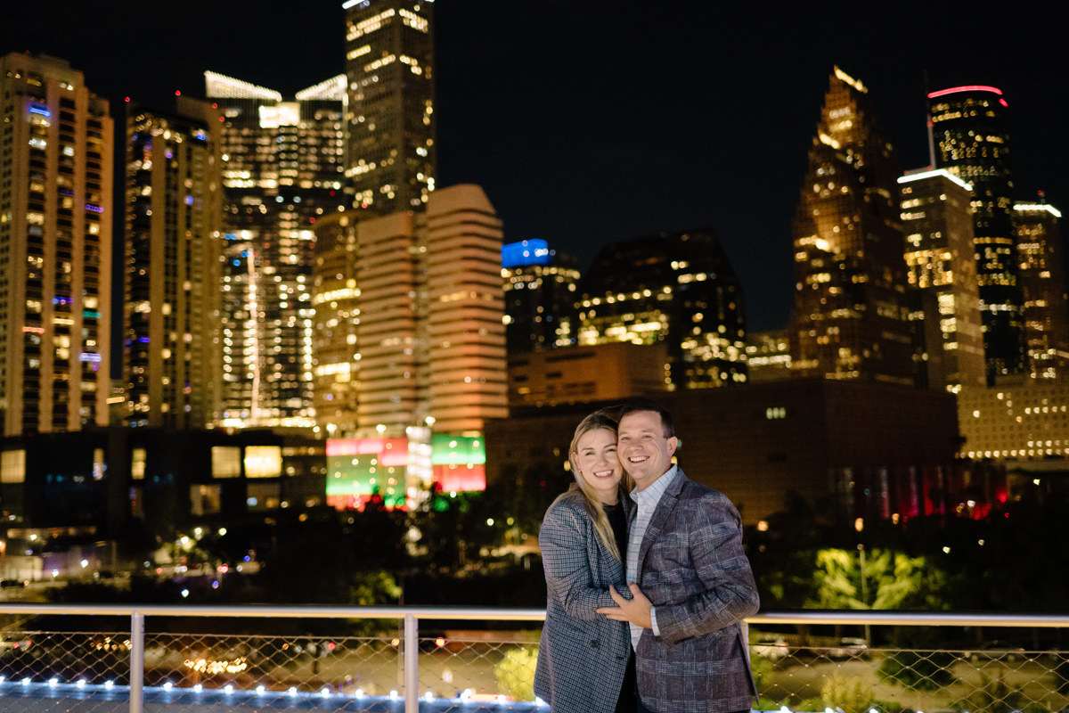 Post houston HTX garden rooftop proposal session during christmas with night houston skyline background