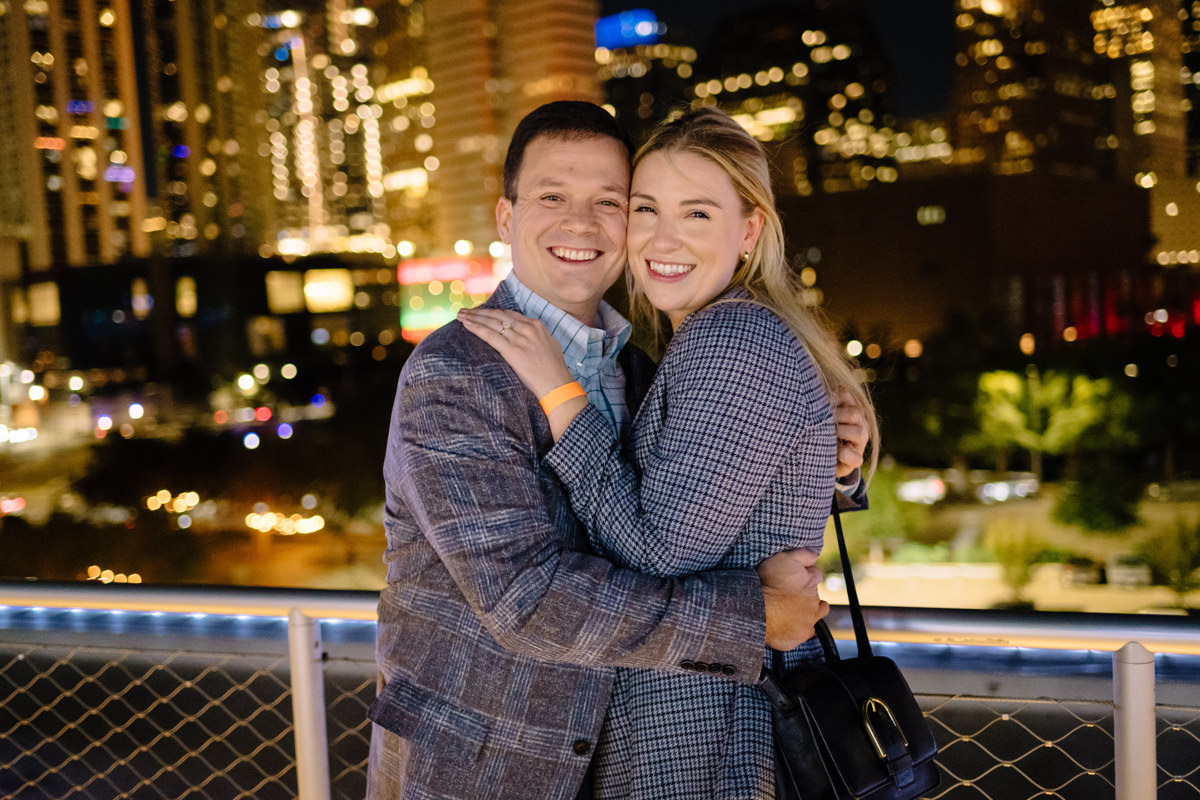 Post houston HTX garden rooftop proposal session during christmas with night houston skyline background