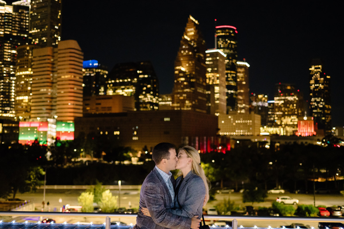 Post houston HTX garden rooftop proposal session during christmas with night houston skyline background