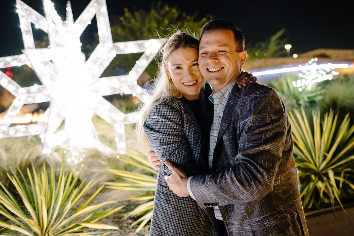 Post houston HTX garden rooftop proposal session during christmas with night houston skyline background