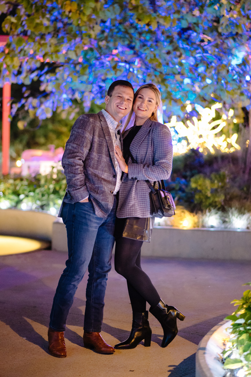 Post houston HTX garden rooftop proposal session during christmas with night houston skyline background