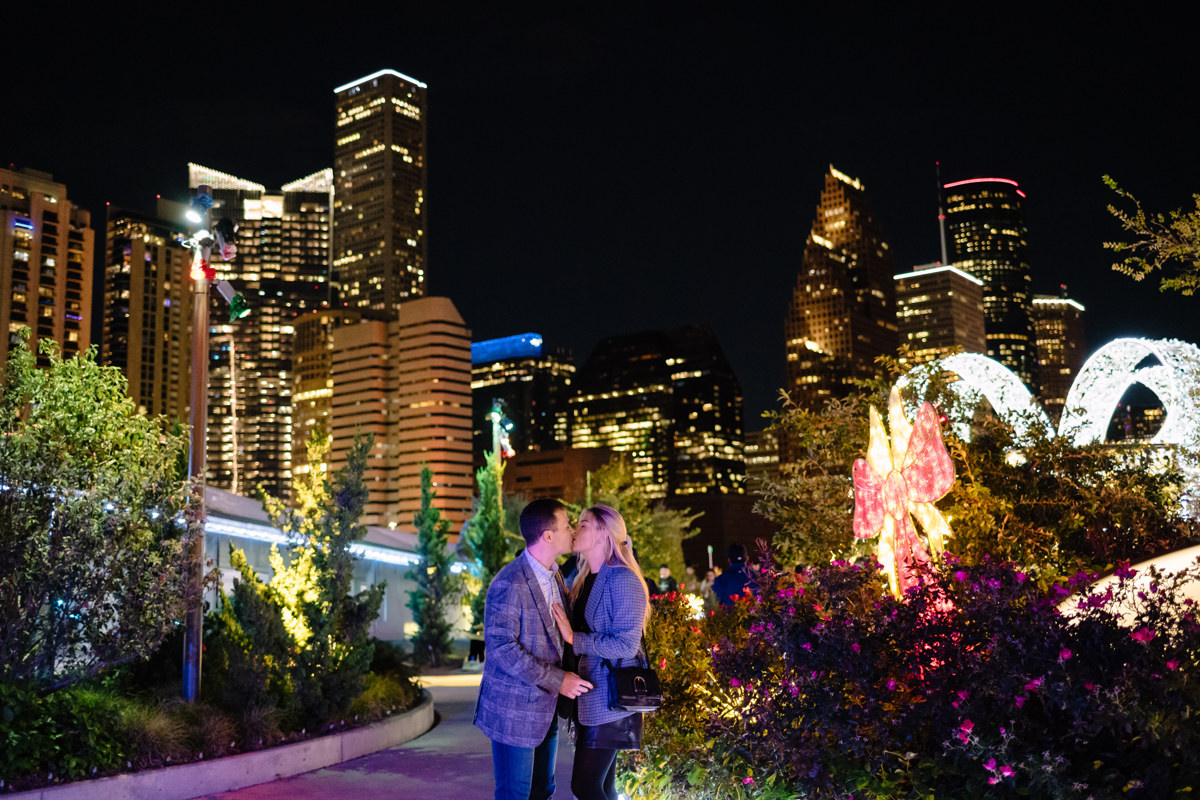 Post houston HTX garden rooftop proposal session during christmas with night houston skyline background