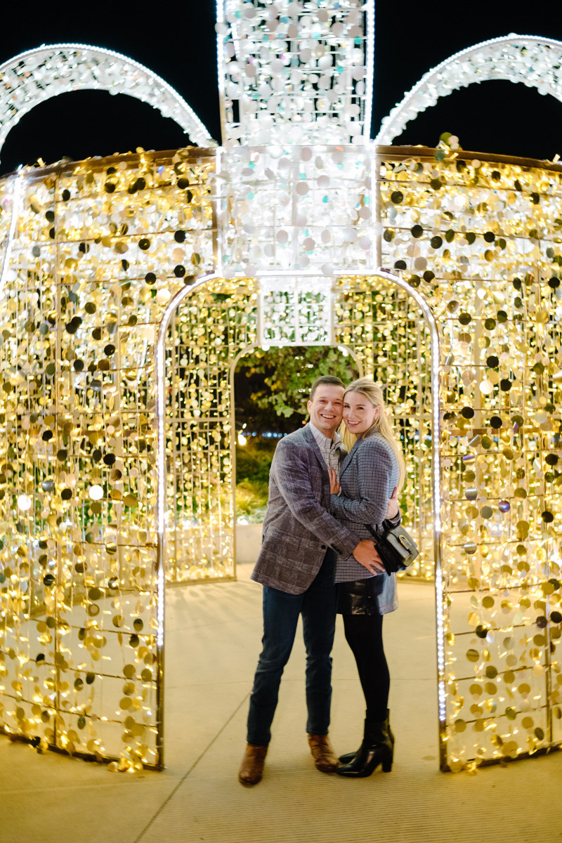 Post houston HTX garden rooftop proposal session during christmas with night houston skyline background