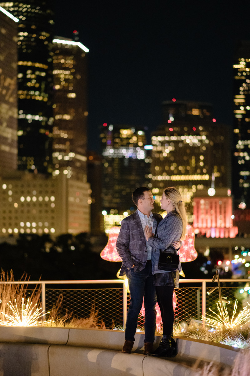 Post houston HTX garden rooftop proposal session during christmas with night houston skyline background