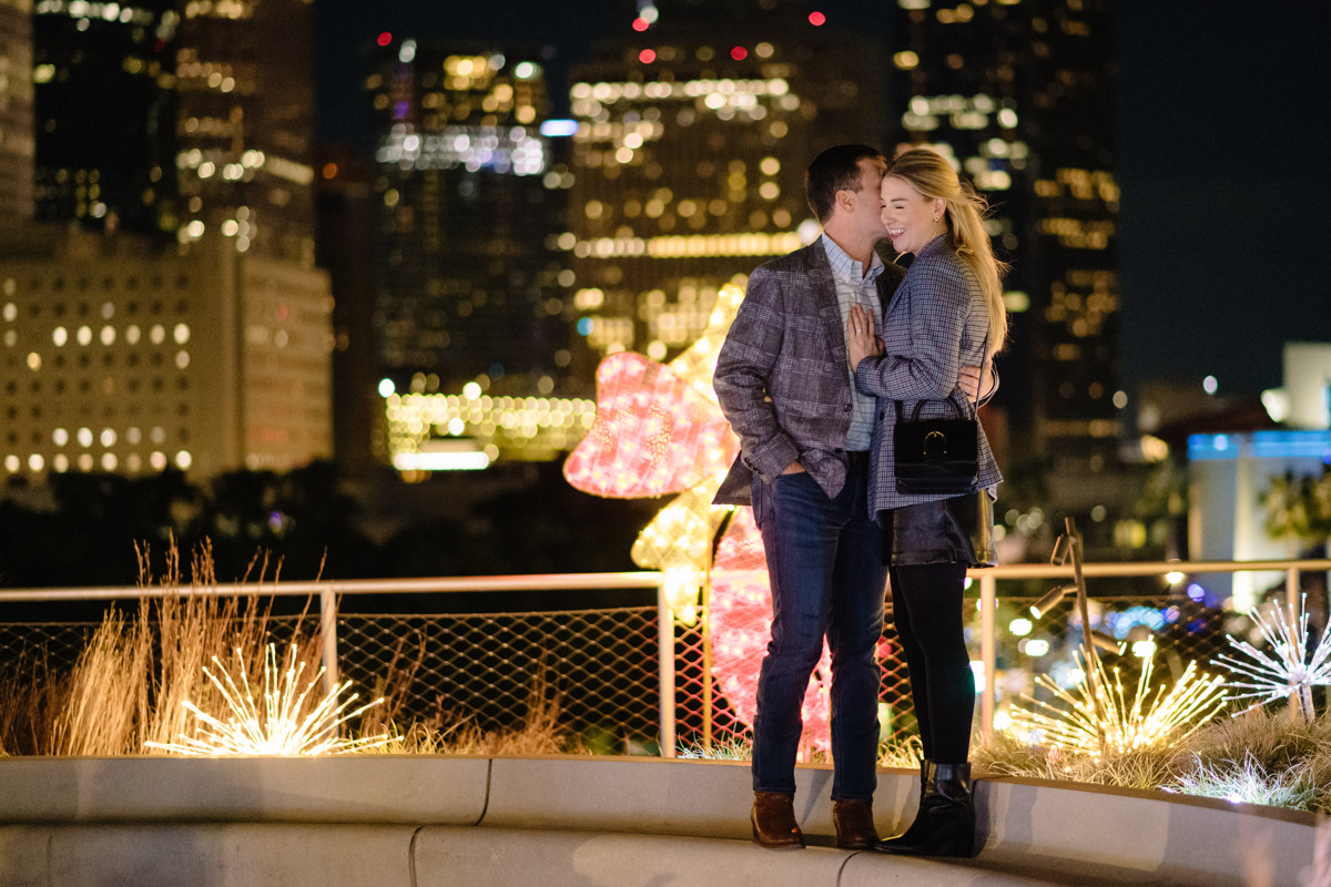 Post houston HTX garden rooftop proposal session during christmas with night houston skyline background
