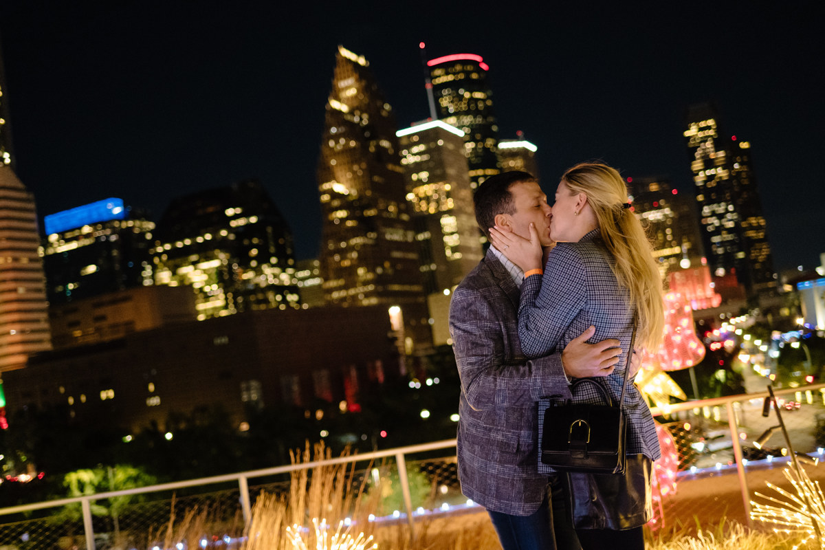 Post houston HTX garden rooftop proposal session during christmas with night houston skyline background