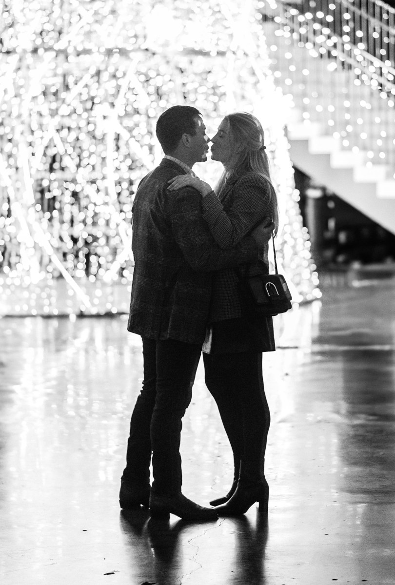 Post houston HTX garden rooftop proposal session during christmas with night houston skyline background