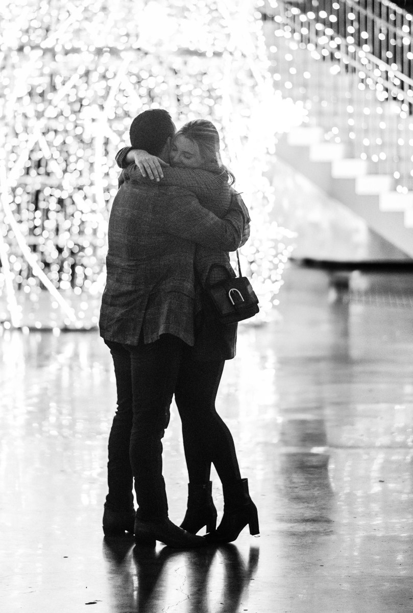 Post houston HTX garden rooftop proposal session during christmas with night houston skyline background
